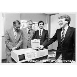 Spectrophotometer donated to Chemistry department by Hewlett Packard. Professor Ray Martin (left), Vice-Chancellor; Professor Ron Brown, and Messrs Bruce Graham and John Lynch of Hewlett Packard