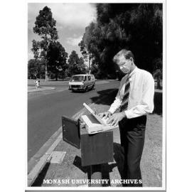 Dr Bill Young collecting data from traffic counter