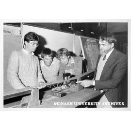 Winners of Primitive Primordial Pristine Cupreous Bridge Competition. Phillip Black (left), Marcus Leonard and Richard Green, with Professor Noel Murray
