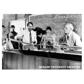 Judge, Mr Milton Johnson (right) with Professor Noel Murray and competitors in Primitive Primordial Pristine Cupreous Bridge Competition