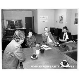 Professors Mal Logan (left), Alan Henry and John Hay with Mrs Maria Kouppas of Opal Male Fashions, member of Monash Friends of the Australian Institute of Archaeology in Athens