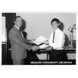 Mr Geoff Dober presenting Australian Computer Society Award to Tan Thow Keng