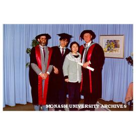 Xia Guangzhi, first Master of Educational Policy and Administration graduate, with wife Cao Li; Assistant Professor Gerald Burke (left) and Dean of Education Professor David Aspin