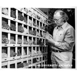 Senior technical officer, Karl Weber examining mineral specimens