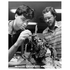 Research assistants Craig Cleeland (left) and Mick Whitelaw examining fossilised skull