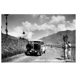 Students Danny Vukadenovic (left) and Jerry Sukhyar heading towards volcano Dieng (centre background)