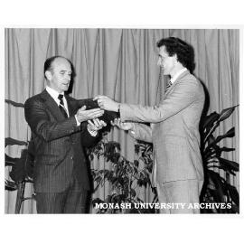 Denis Blom (right) receiving J. W. Dodds Memorial Prize from Assistant General Manager of Riley Dodds Australia, Mr Gordon Page