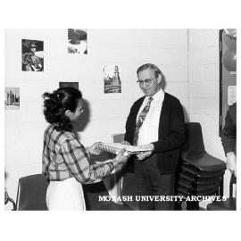 Mala De Silva presenting Professor Goran Hammarstrom (founding chairman of Linguistics) with retirement gift