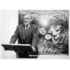 Melbourne University Vice-Chancellor Professor David Derham opening Monash-Melbourne art exchange exhibition, in front of the Arthur Boyd work 'Nude in a Cornfield'