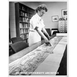 PhD candidate, Mimi Colligan, with cyclorama of early Melbourne