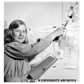 Ms Anna Howe with maps showing concentration of Melbourne's old people