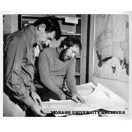 Associate Professor Jim Whitelaw (left) and Mr John McKay with migration charts