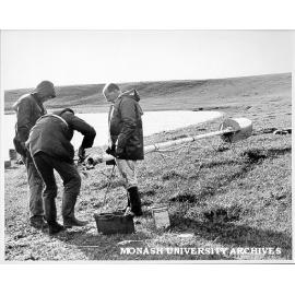 Dr Patrick De Deckker and team members preparing Mackereth sampler to take core in West Basin near Colac