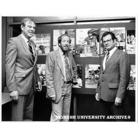 Herve Alleaume exhibition - 'Oakleigh: Portrait of the New Society'. Mr Robert Downey, Director of Victorian Ministry of Immigration and Ethnic Affairs (left), Monash geographer John McKay, and former Monash photographer Herve Alleaume