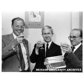 Toasting 20 years of publishing 'Australian Journal of French Studies'. Editor Associate Professor Wallace Kirsop (centre), associate editor Dr Jacques Birnberg (right) and editorial board member Dr Gaston Hall