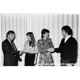 Joint winners of Alliance Francaise Prize, Fiona Perry (centre left) and Susan Barkehall-Thomas being congratulated by Professor Brian Nelson (left) and Mr Patrick Coustance