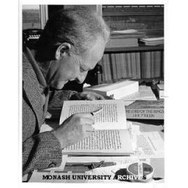 Professor Arthur Brown studying manuscript