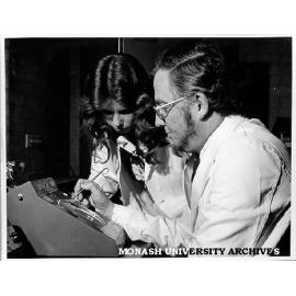 Laboratory technician Linda Newman assisting Professor Bruce Holloway