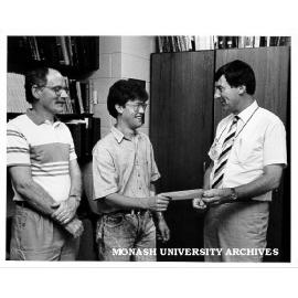 Student Cameron Johnson receiving Phyllis Hillgrove Scholarship from Dean of Science Professor Ian Rae. Dr David Smyth (left)