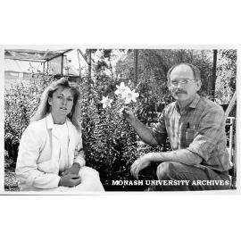 Dr David Smyth and student Ms Jenny Ryding with regal lily