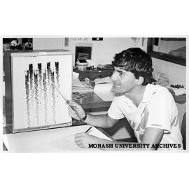 Student John Sentry examining DNA sequence of lily