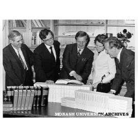 Acting Consul General for Germany, Dr Georg F. Sperl presenting set of journal reprints, with from left: Professor Leslie Bodi, Mr T. B. Southwell, Dr and Mrs Sperl, and Dean of Arts, Professor Guy Manton