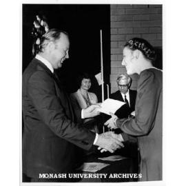 Penleigh and Essendon Grammar student, Janet Watson, receiving Goethe Poetry Prize from Dr Karl-Heinz Scholtyssek, in background German department's Mrs Gisela Tiemann-Kaplan and Professor Leslie Bodi