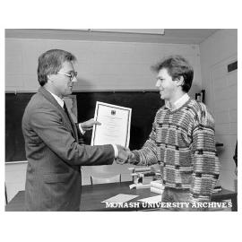 Torsten Weller receiving Goethe Prize from representative of Consul General of Germany Mr Wolfgang Will