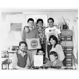 Springvale Legal Service complainants with compensation from CUB, clockwise from bottom left: George Georgiou, Bruce Webb, Stuart Baron, Jeff Giddings, Denise Woolerton, Michael Cosgrave (tutor) and Greg Crundall