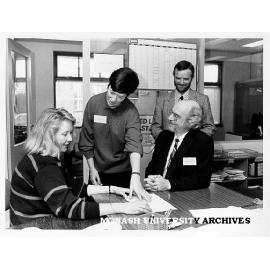 Springvale Legal Service staff, from left: Susanne Liden, Susan Miller and (standing) coordinator Adrian Evans, with Mr Julian Gardner director of Legal Aid at Legal Aid Commission of Victoria