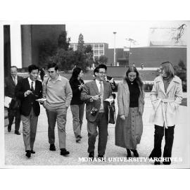 Visiting Japanese journalists being escorted around campus by students, students from left: Keith Shiell, Janis Hobbs, Ellen Parbo and Amanda Crothers
