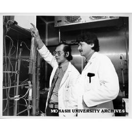 Clinical Associate Professor M. B. van der Weyden (right) and Dr T. E. Gan, purifying foetal thymidine kinase