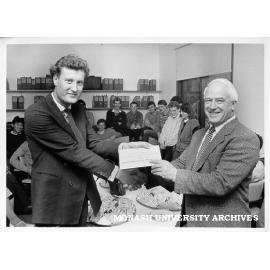 Mr Grant Custance of Bongiorno and Co.(Aust.) Ltd. presenting plaque to Professor Neil Carson to commemorate the company's contribution to the department of Community Medicine