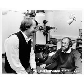 Drs Barry Muddle (left) and Richard Hannink in front of electron microscope