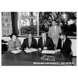 Signing contract for Plastics Association database for Centre for Advanced Materials Technology, from left: Ms Susan Ryan, Mr Tony Rogers, Professor Mal Logan, Dr Paul Hudson and Professor Paul Rossiter