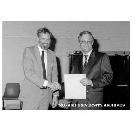 Gavan Rosman (left) presenting Noel Clothier with Telecom Australia Prize