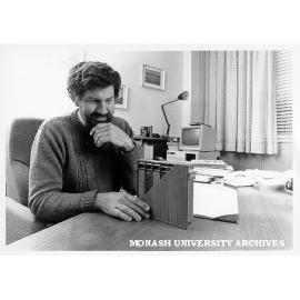 Dr Paul Rossiter with cut-away model of Pulsar car battery