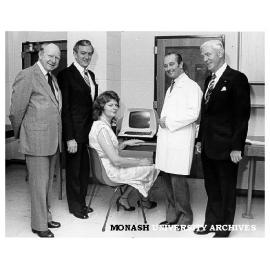 Mary Lucas, technician in Pathology and Immunology, with her prize microcomputer, with her from left: Mr Ron Stewart (AWA), Education Minister Wal Fife, Professor Richy Nairn and Mr John Harbersberger