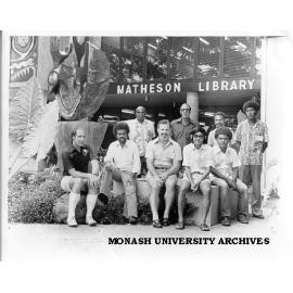 Mr I. Thomas, Dr T. Hore and Mr N. Paget with members of staff in front of Matheson Library at Lae Unitech