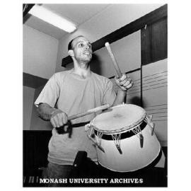 Mr Chris Lesser leader of Melbourne based African musical-dance group, Adzohu, playing Ghanian drum