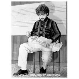 Hungarian musician Robert Mandel playing hurdy-gurdy