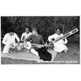 Indian musician Ustad Amjad Ali Khan (second from right) playing sarod, accompanied by (from left) Deb Chakravati, Ashit Ghatak and Sharafat Khan