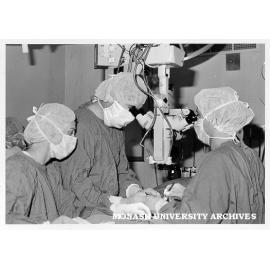 Dr Peter Temple-Smith (centre) with microsurgeon Mr Graeme Southwick (right) and attending nurse Sister Ronnie Hobday