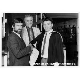 Marcus Schmidt (right) winner of Tubemakers Australia Prize with Mr Leigh Fletcher of Tubemakers (left) and Professor R. W. Cahn of Cambridge University