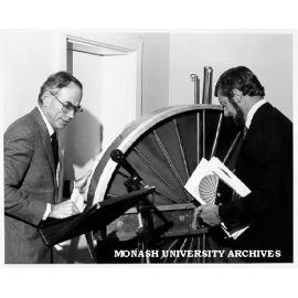 Mr Charles Ambrose and Senator Gareth Evans, in front of rotary regenerative heat exchanger