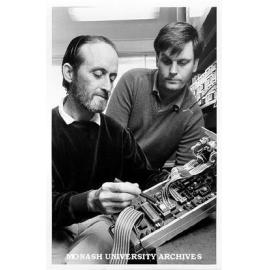 Dr Deane Blackman (left) and technical officer Ken Sheridan, examining wave recorder