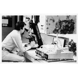 Mr Jack Stecki using ferroscope to examine contaminated oil from aircraft gearbox