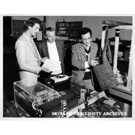 Student Keith Edwards (left), Dr Rod Tobin and Dr Len Koss, preparing bismuth target for vibration testing of structural material