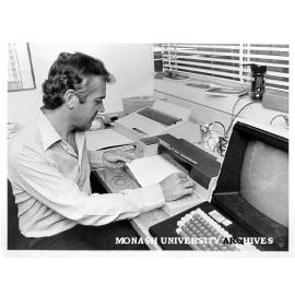 Dr Brian Chapman pulling biomedical simulation printout from plotter