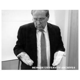 Professor Roger Short displaying condoms of the future